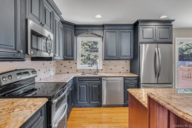 Beautifully updated 4-bedroom, 4-full-bath Expanded Split set on - photo 4
