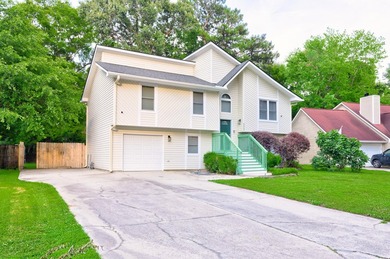 Welcome to 4608 Moss Court, a beautifully updated 4-bed, 2-bath - photo 1