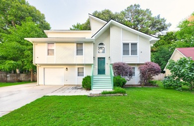 Welcome to 4608 Moss Court, a beautifully updated 4-bed, 2-bath - photo 2