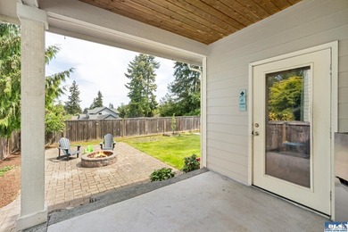 Tucked beyond a paved driveway and framed by crosswood fencing - photo 12
