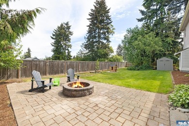 Tucked beyond a paved driveway and framed by crosswood fencing - photo 13