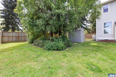 Tucked beyond a paved driveway and framed by crosswood fencing - photo 16