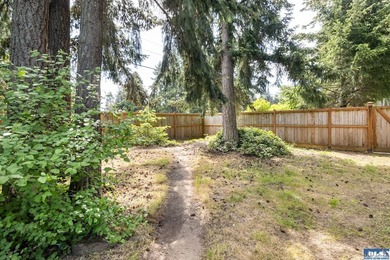 Tucked beyond a paved driveway and framed by crosswood fencing - photo 17