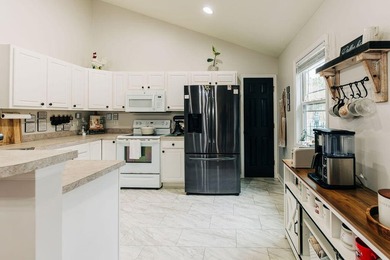 Welcome to this charming 3-bedroom, 2-bathroom home featuring a - photo 9