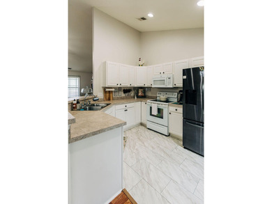 Welcome to this charming 3-bedroom, 2-bathroom home featuring a - photo 10