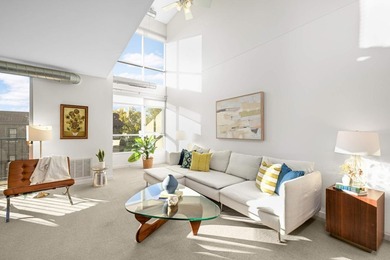 This stylish two story loft offers modern living with all the - photo 2