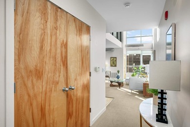 This stylish two story loft offers modern living with all the - photo 4