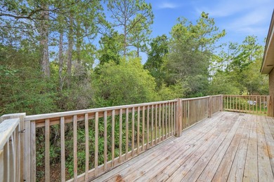 Set on a huge 0.52 acre lot with peaceful forest views, this - photo 4