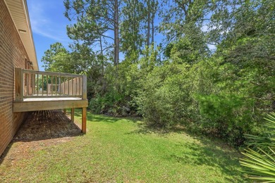Set on a huge 0.52 acre lot with peaceful forest views, this - photo 5