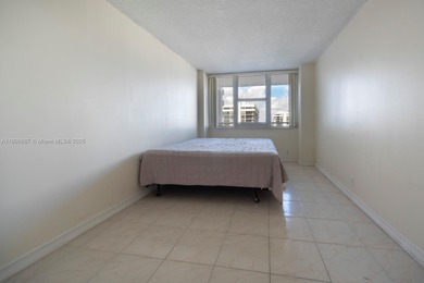 Just steps from the sand, this large 736 sqft 1-bedroom condo at