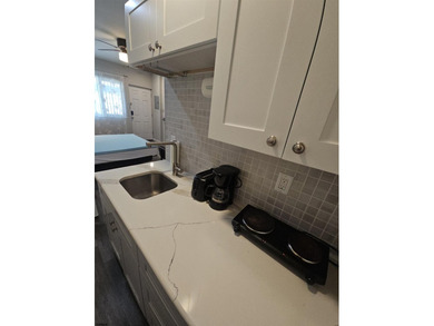 This charming studio condo offers an ideal blend of - photo 8