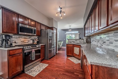 Welcome to this beautifully UPDATED END-UNIT townhome in the - photo 9