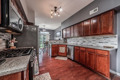 Welcome to this beautifully UPDATED END-UNIT townhome in the - photo 10