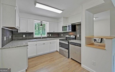 Updated and immaculate 4-side brick ranch located next to the