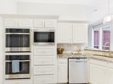 Grand marble tile entry and soaring ceilings set the tone in - photo 7