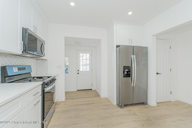 Discover your dream home at 11 Laforge Ave! This renovated - photo 7