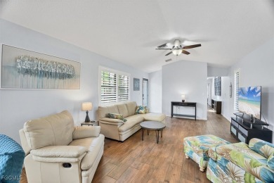 Discover effortless coastal charm in this rare end-unit villa