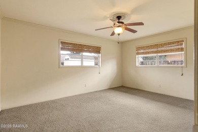 Underneath the branches of a mature live oak tree sits this