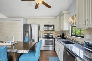 Discover effortless coastal charm in this rare end-unit villa