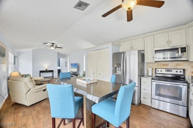 Discover effortless coastal charm in this rare end-unit villa