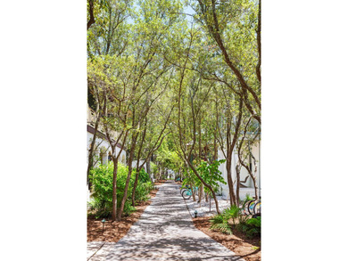 This timeless, Rosemary Beach home offers an inviting covered - photo 7