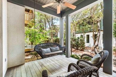 This timeless, Rosemary Beach home offers an inviting covered - photo 8