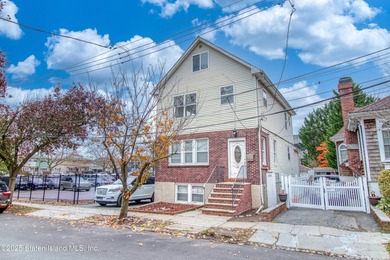 Rare find! This legal three-family home offers exceptional - photo 1