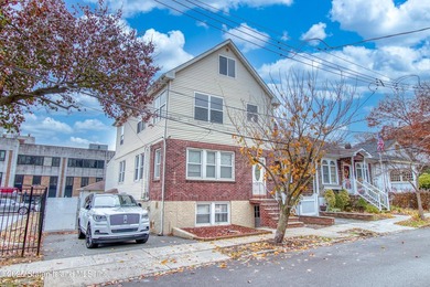 Rare find! This legal three-family home offers exceptional - photo 2