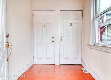 Rare find! This legal three-family home offers exceptional - photo 4