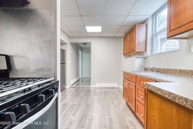 Rare find! This legal three-family home offers exceptional - photo 9