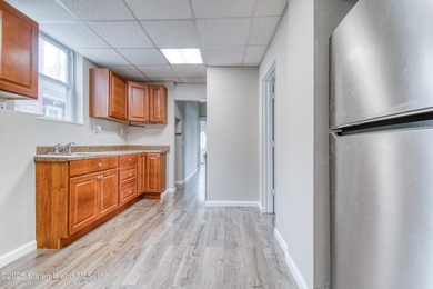 Rare find! This legal three-family home offers exceptional - photo 10