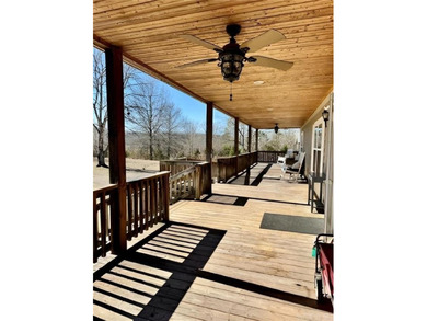 Well-maintained home on approximately 6 acres with a stocked