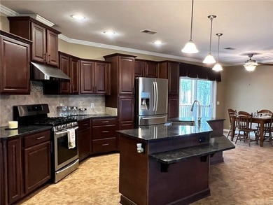 Well-maintained home on approximately 6 acres with a stocked