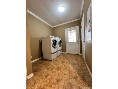 Well-maintained home on approximately 6 acres with a stocked