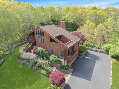 Set within the quiet Rolling Woods neighborhood on a shy acre at - photo 1