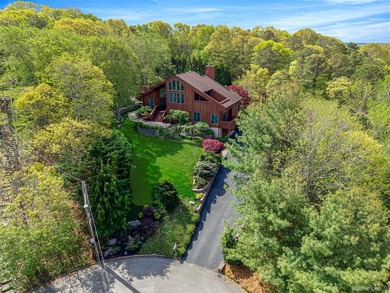 Set within the quiet Rolling Woods neighborhood on a shy acre at - photo 4