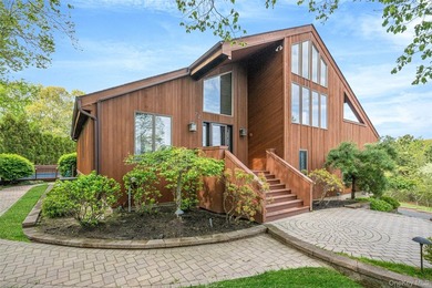 Set within the quiet Rolling Woods neighborhood on a shy acre at - photo 5