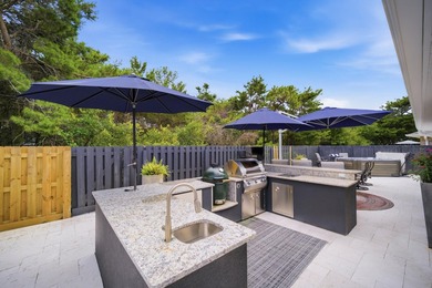 Welcome to this beautifully upgraded coastal retreat in the - photo 1
