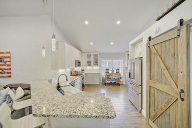 Welcome to this beautifully upgraded coastal retreat in the - photo 4