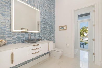 This new construction waterfront residence, completed in 2023 - photo 23