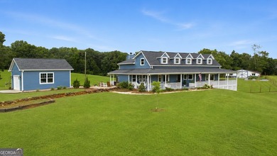 A beautifully remodeled farmhouse situated on 13.39 private - photo 1