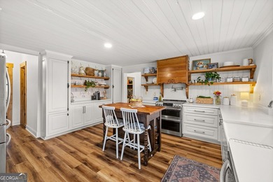 A beautifully remodeled farmhouse situated on 13.39 private - photo 6