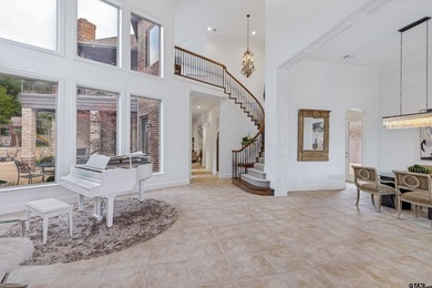 Situated in the prestigious gated community of The Lakes on - photo 6