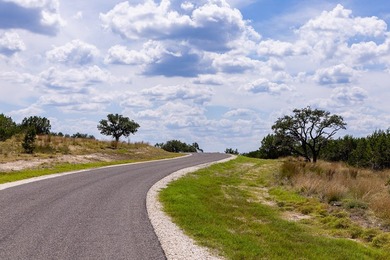 The dramatic 100-foot elevation change on this 12.96-acre tract - photo 11