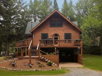 This magnificent year-round log home on First Lake offers 200 - photo 3