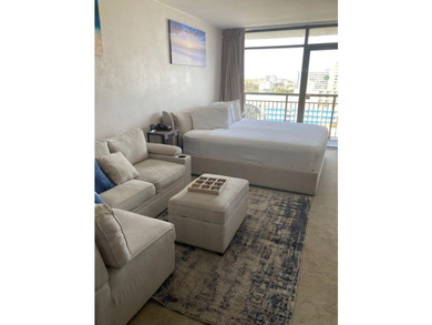Carpet and wood floors; king bed and large sofa. Updated unit - photo 7