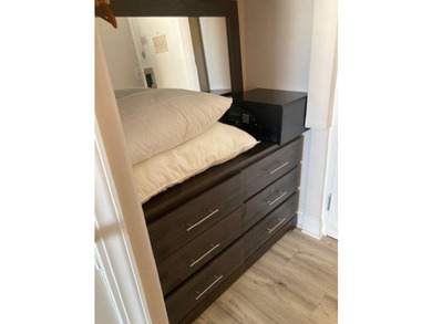 Carpet and wood floors; king bed and large sofa. Updated unit - photo 10