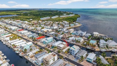 Canal front opportunity with direct ocean access! Located in a - photo 22
