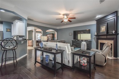 Welcome to this beautifully maintained four-bedroom, three-bath