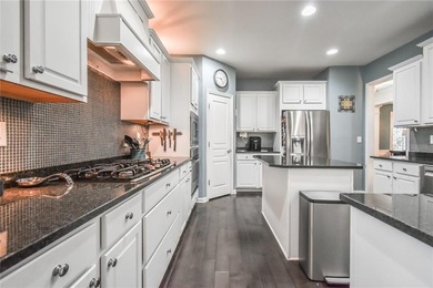 Welcome to this beautifully maintained four-bedroom, three-bath